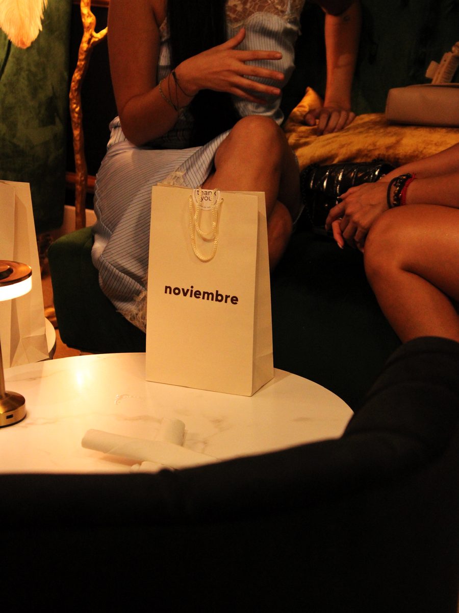 A noviembre gift bag on the table in the lounge